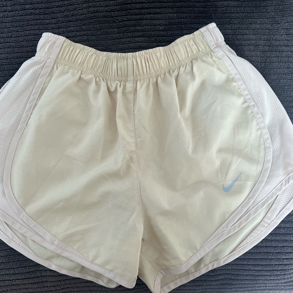 Nike Women's Cream Athletic Running Shorts with Light Blue Swoosh